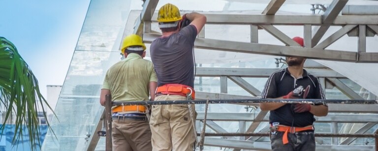 Commercial contractors working on glass roof