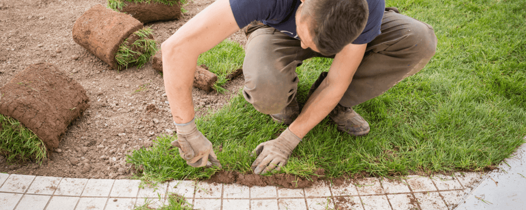 Landscaper works on walkway