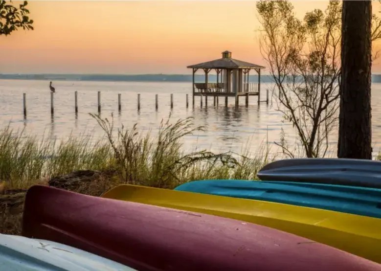 canoes stacked on a beach in Alabama