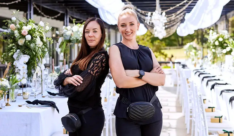 Two business owners preparing their business for wedding season