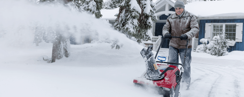 Man using a snowblower