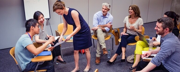 Education consultant in circle of chairs