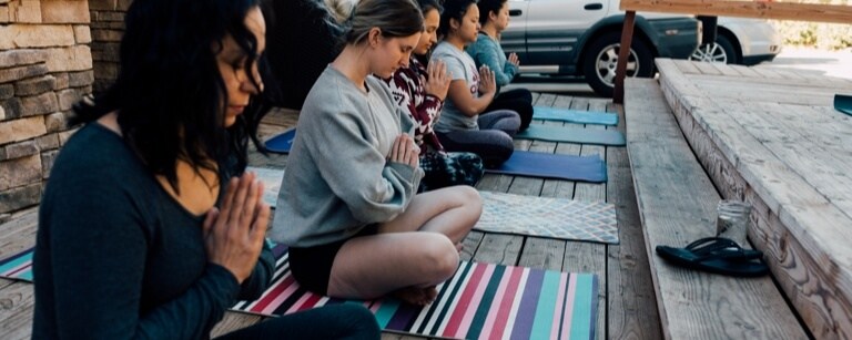 Pilates class taking place outdoors