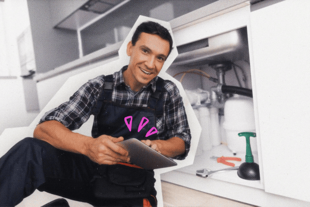A plumber using a tablet device.