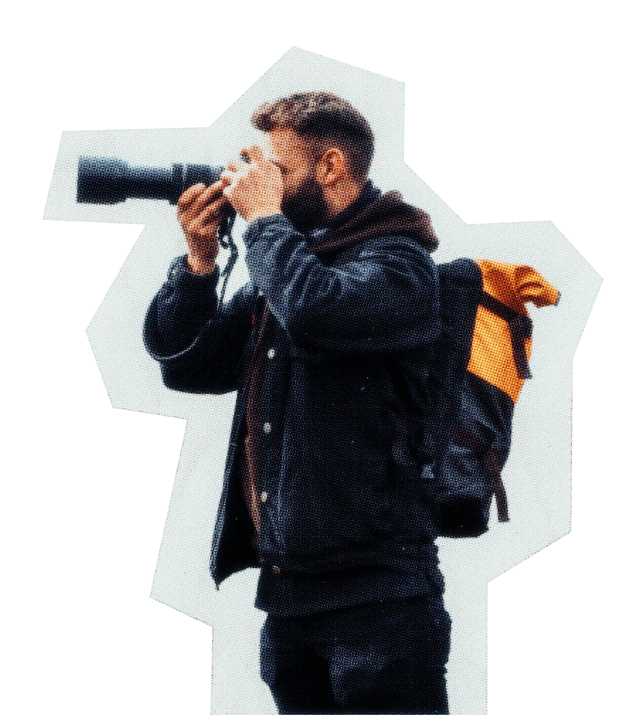 Photographer holding camera up to his face