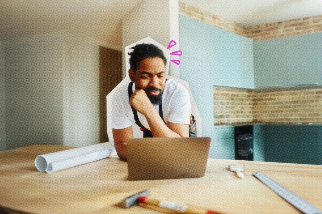 Handyman using AI on his laptop