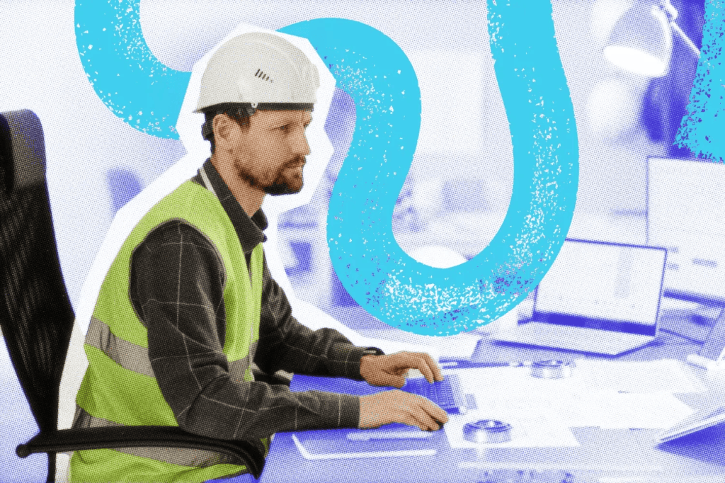 Construction manager working on an estimate at his desk.