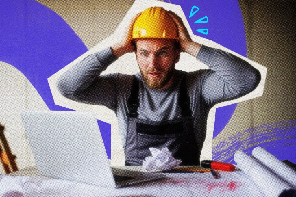 Surprised contractor looking at an error on his laptop screen.