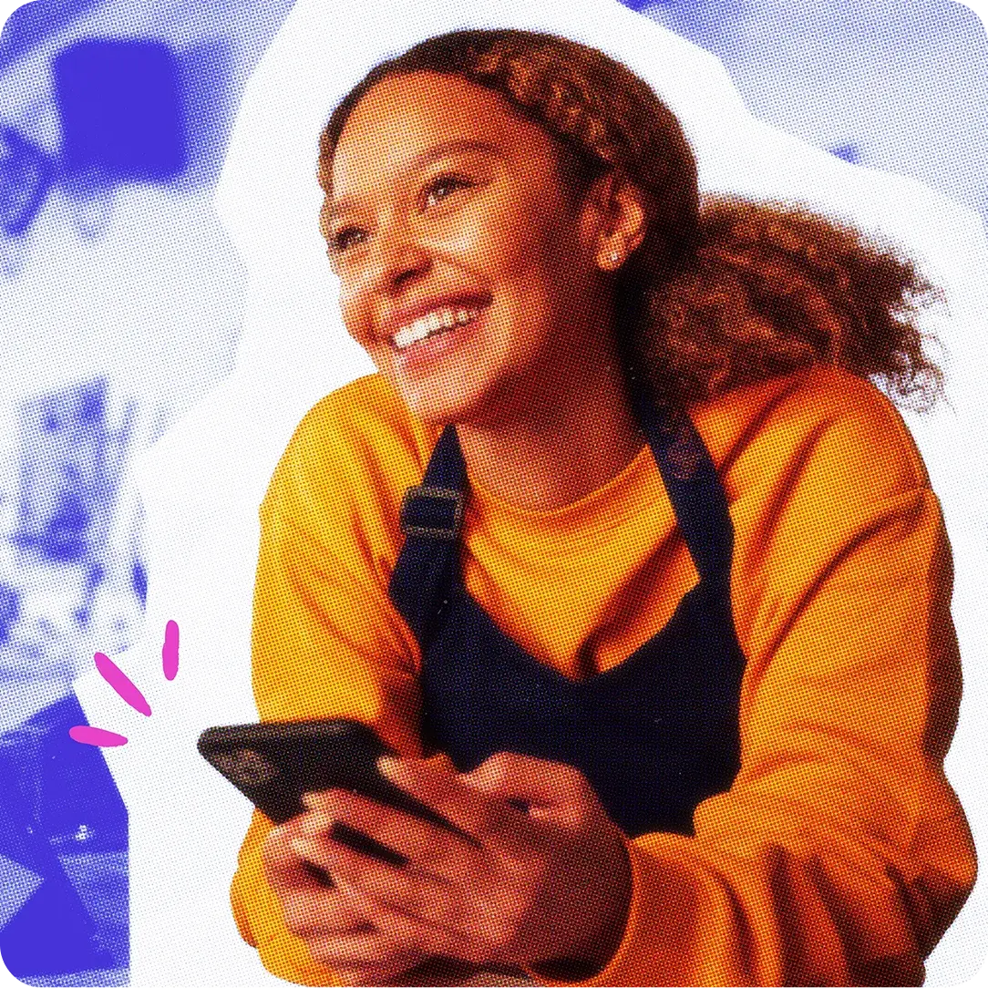 Smiling woman holding her phone