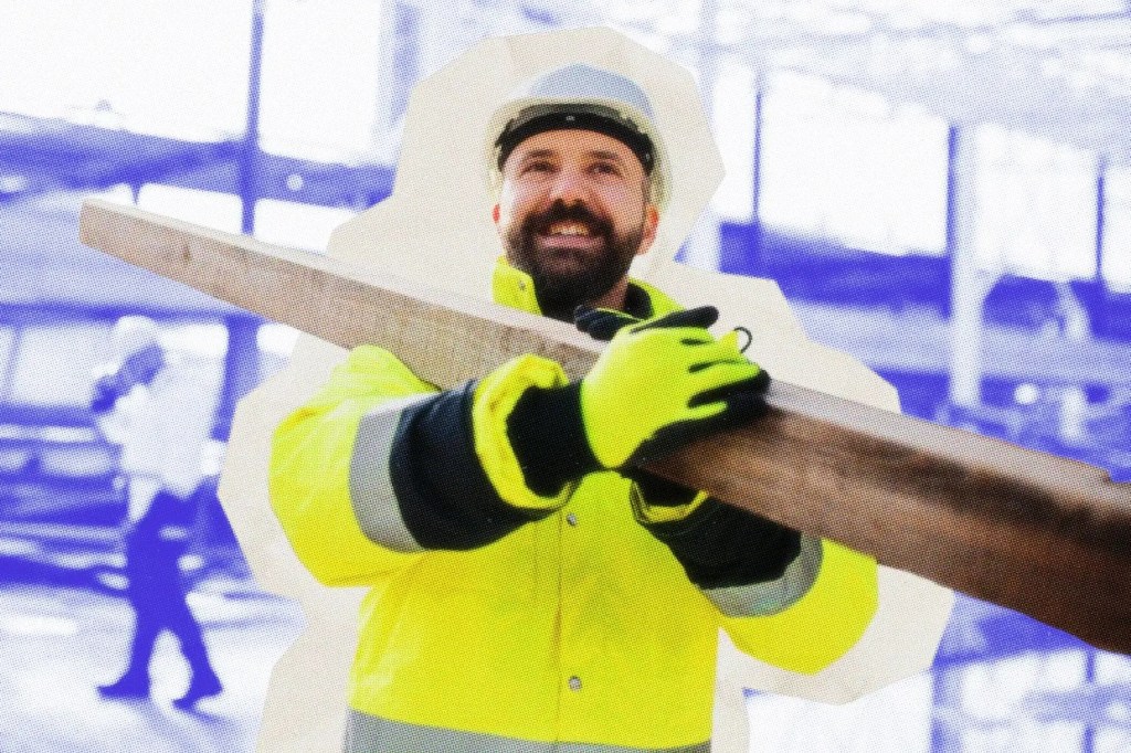 Contractor carrying a 4x4 post