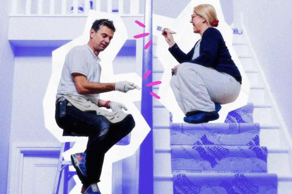 Two painters painting a railing.