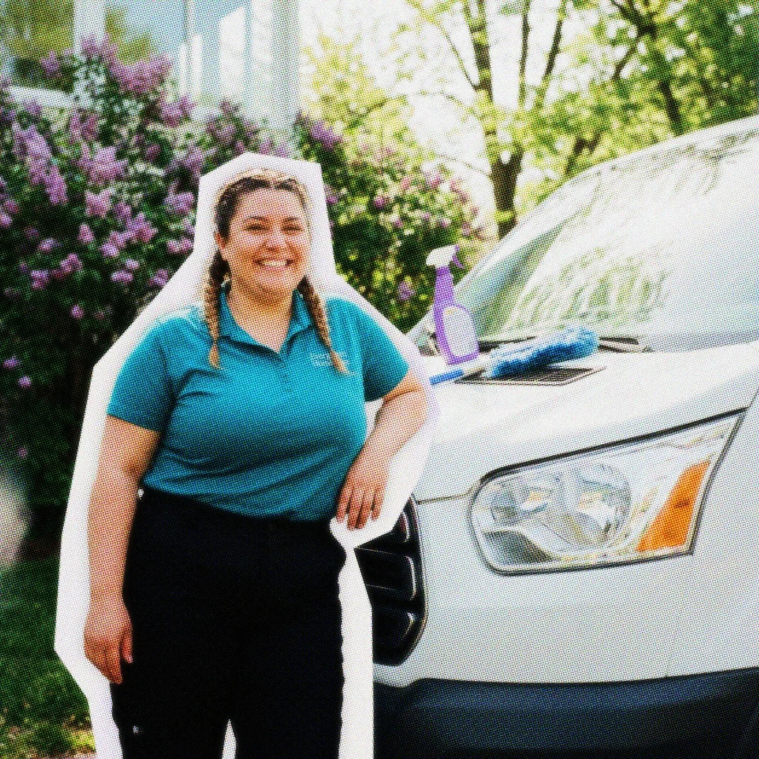 Housekeeper smiling by her van